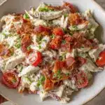 Delicious BLT Chicken Salad with bacon, lettuce, tomatoes, and grilled chicken served in a bowl.
