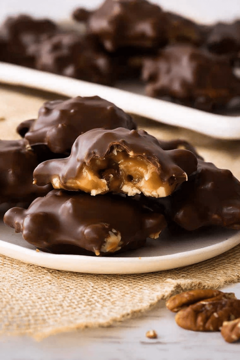 Delicious homemade chocolate turtles with pecans on a decorative plate