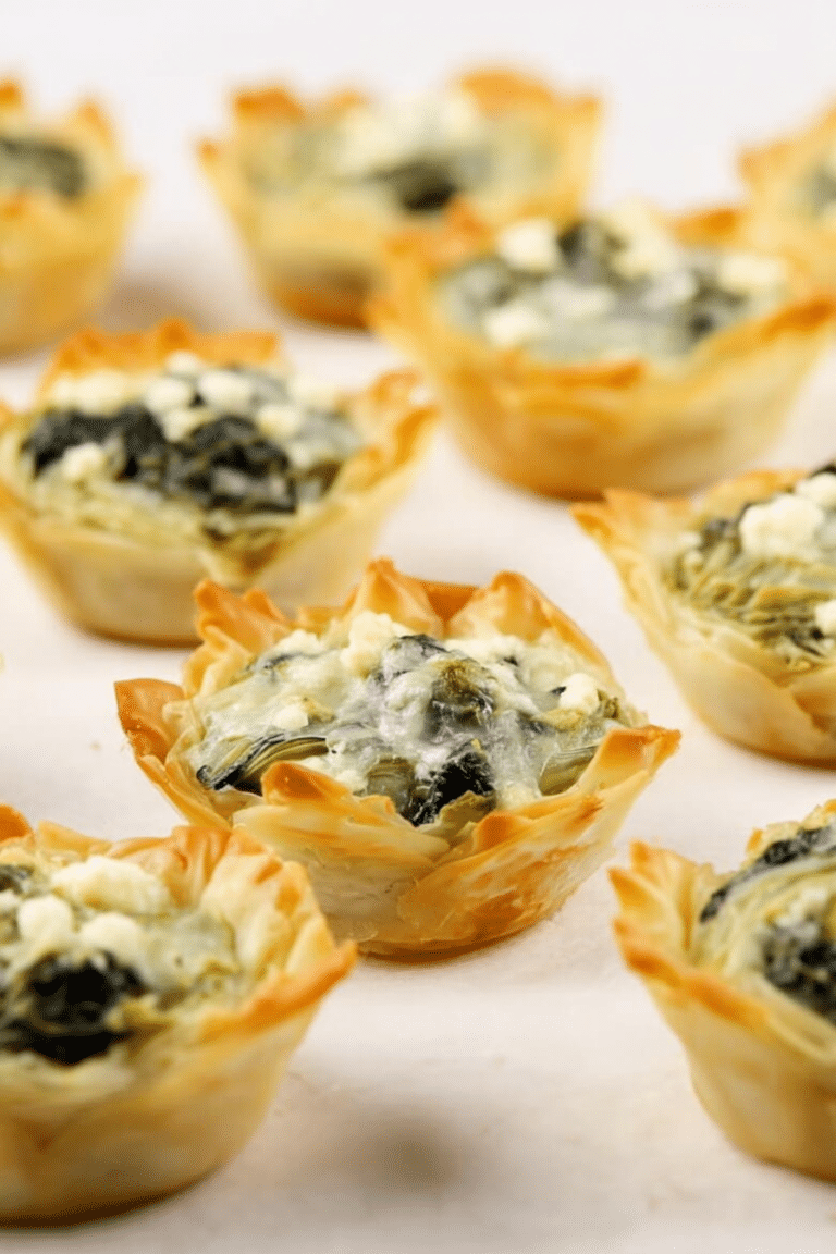 Delicious spinach artichoke bites served on a wooden platter with parsley garnish.