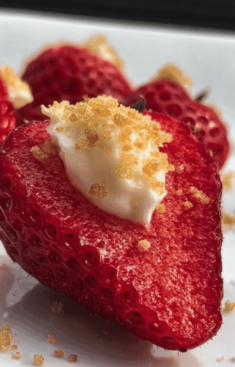 A colorful assortment of deviled strawberries filled with cheesecake cream, perfect for party appetizers.